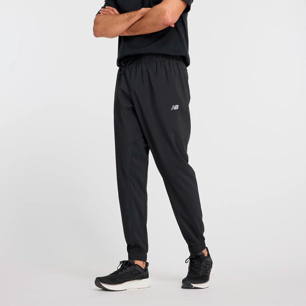 New Balance Essentials Woven Training pants Men - black