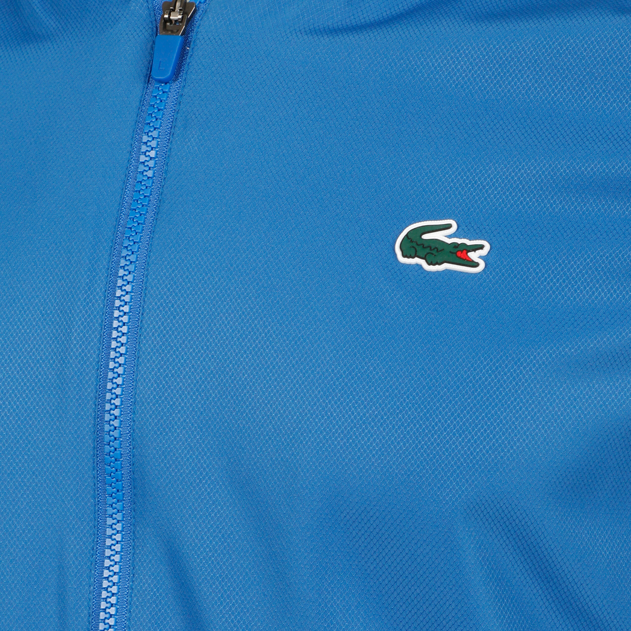 Orange store lacoste tracksuit